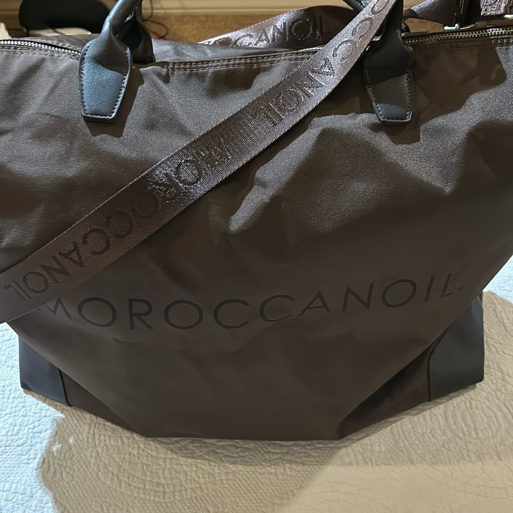MoroccanOil tote with adjustable shoulder strap.